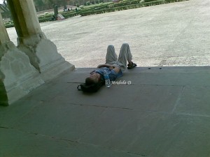 Tourist sleeping at Agra Fort