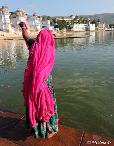 A Woman in Traditional Attire at Pushkar Lake, Rajasthan, India