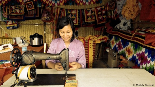 A girl sewing in Paro, Bhutan