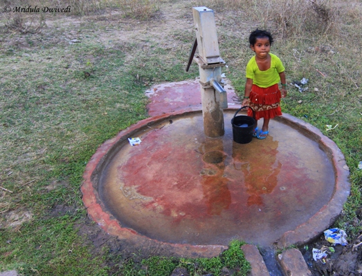 A small girl fetching water