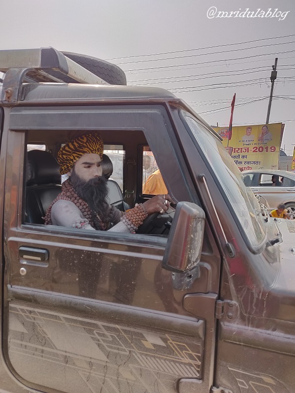 naga sadhu driving a jeep