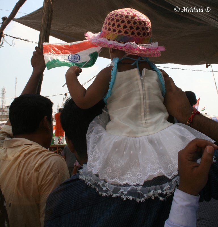 A Little Girl on Her Father's Shoulders at Ramlila Maidan