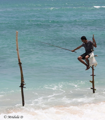 https://traveltalesfromindia.in/wp-content/uploads/2013/04/A-Tourist-Doing-Stick-Fishing-Sri-Lanka.jpg