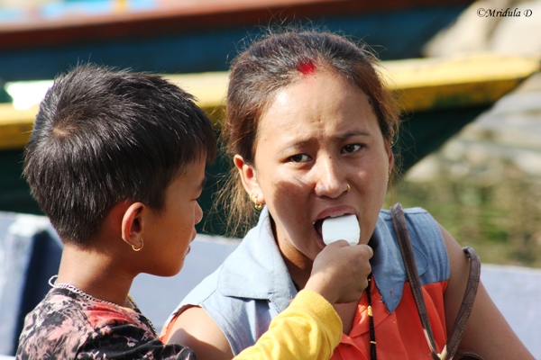 A Boy Sharing Icecream with his Mummy