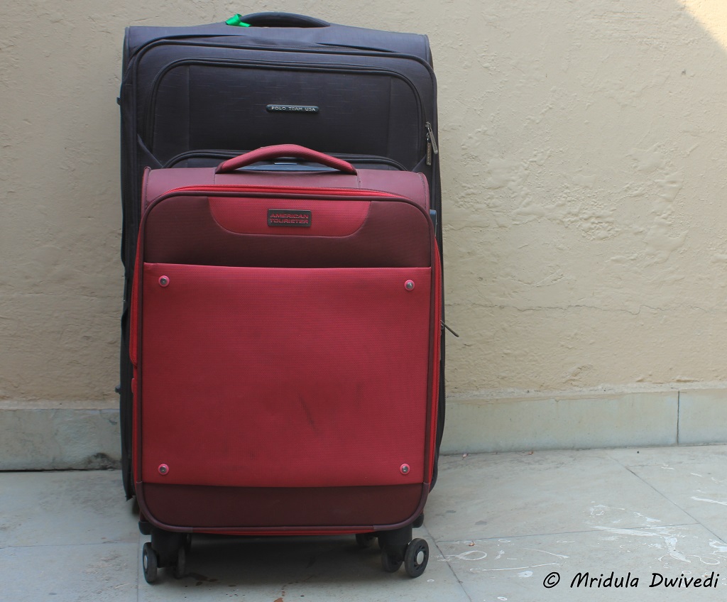 a red color suitcase