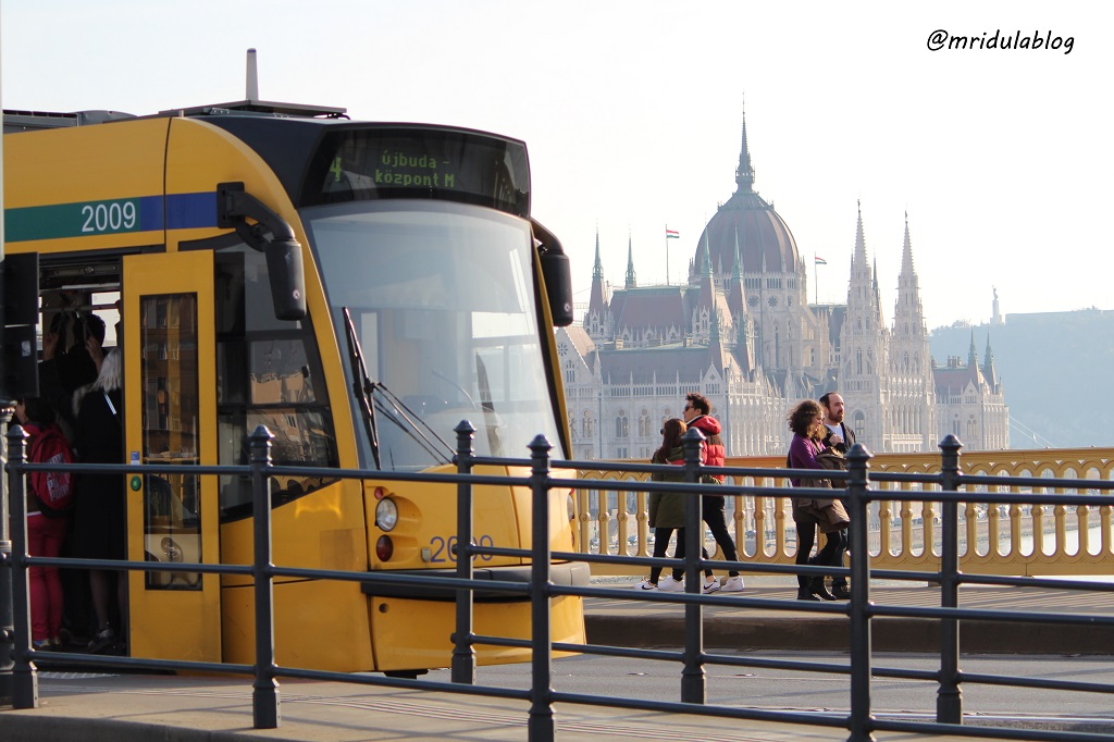 A tram in front of the parliament house, Budapest, Hungary