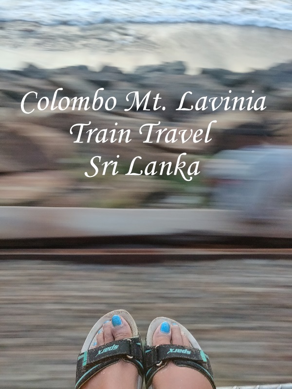 A tourist putting her feet on the foot-board of a moving train