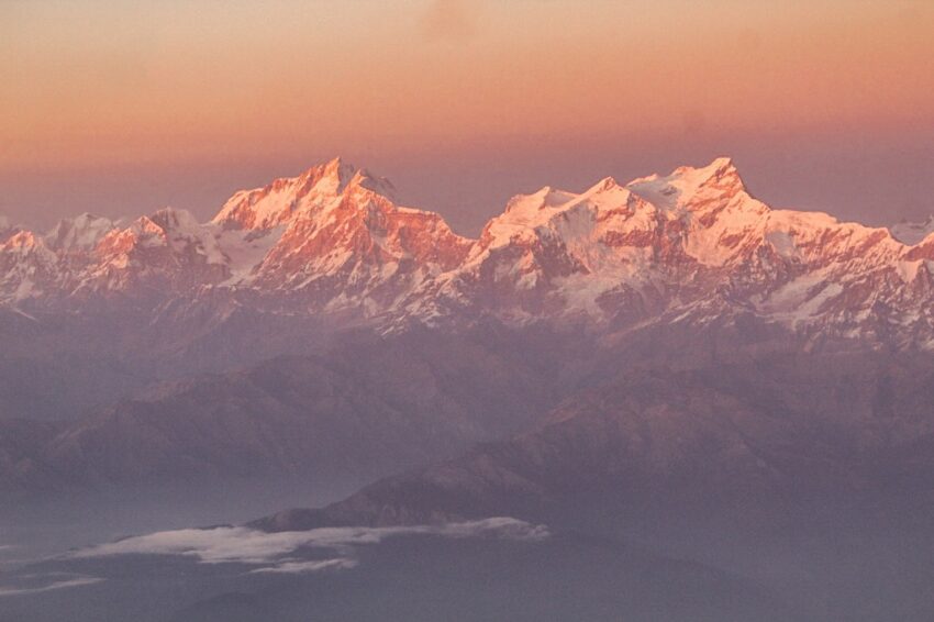 A view of the majestic Himalayas at sunset from a Katthmandu Pokhara Flight